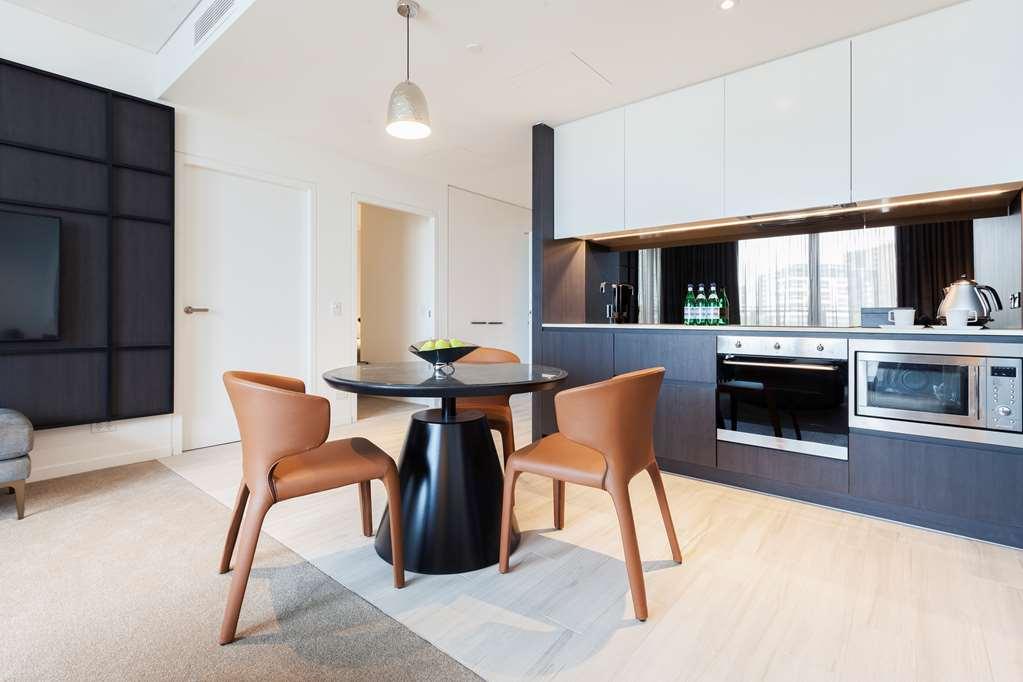 One Global Resorts Green Square Sydney Fasilitas foto The kitchen of a two-bedroom apartment