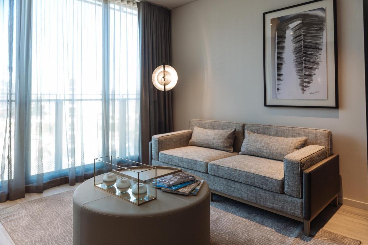 One Global Resorts Green Square Sydney Bagian luar foto A living room at The Ritz-Carlton, DIFC