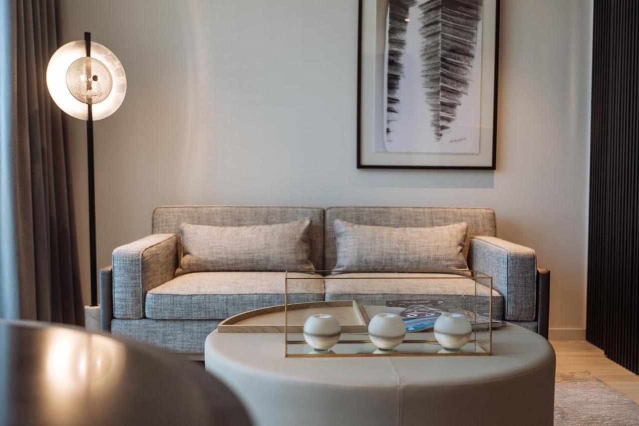 One Global Resorts Green Square Sydney Bagian luar foto A living room at the Ritz-Carlton, DIFC