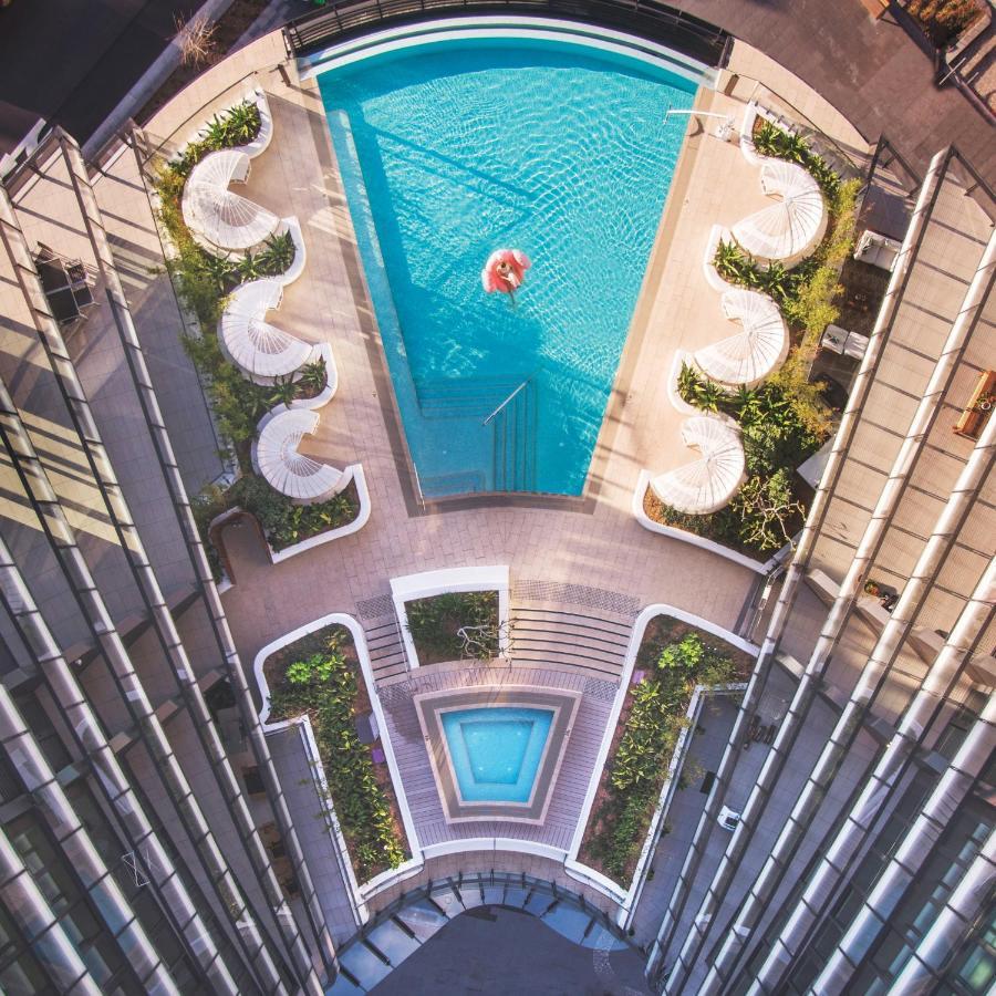 One Global Resorts Green Square Sydney Bagian luar foto The pool at the 1018
